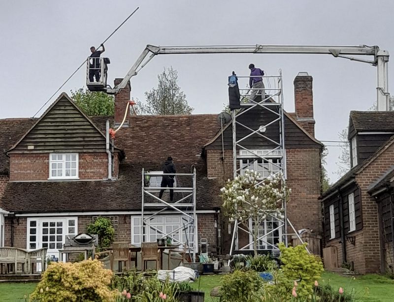The Roof Moss Cleaners using cherry picker and scaffolding to clean roof safely and professionally in Coleford, Gloucestershire