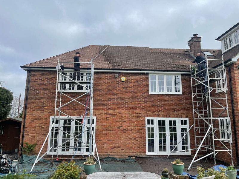 Roof cleaning carried out safely from scaffold towers by The Roof Moss Cleaners in Coleford